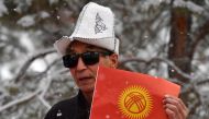 (Files) Demonstrators protest against the changing of the Kyrgyz national flag in Bishkek on December 9, 2023. (Photo by Vyacheslav Oseledko / AFP)