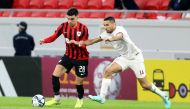 Al Rayyan’s Achraf Bencharki (left) in action against Al Markhiya’s Tameem Mohammed yesterday.