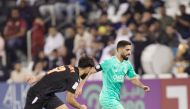 Al Sadd’s Hassan Al Haydos (right) in action against Umm Salal’s Khaled Walid Mansour yesterday. 