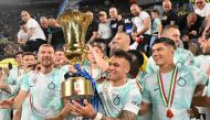 File: Inter Milan's Argentinian forward Lautaro Martinez (C) celebrates with the trophy after winning the Italian Cup (Coppa Italia) final football match between Fiorentina and Inter Milan at the Stadio Olimpico in Rome, on May 24, 2023. (Photo by Alberto Pizzoli / AFP)