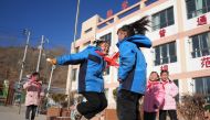 Students play games during a class break at a primary school in Liugou Township of Jishishan County, northwest China's Gansu Province, Dec. 25, 2023. Xinhua/Chen Bin