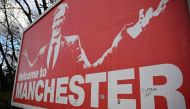 A poster showing British INEOS Group chairman Jim Ratcliffe is seen outside the ground ahead of the English Premier League football match between Manchester United and Bournemouth at Old Trafford in Manchester, north west England, on December 9, 2023.(Photo by Oli SCARFF / AFP)