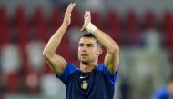 Nassr's Portuguese forward #07 Cristiano Ronaldo greets the fans ahead of the Saudi Pro League football match between Al-Ittihad and Al-Nassr at King Abdullah Sports City Stadium in Jeddah on December 26, 2023. (Photo by AFP)