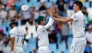 South Africa's Marco Jansen (R) celebrates with South Africa's Dean Elgar (C) after the dismissal of India's Shreyas Iyer (L) during the third day of the first cricket Test match between South Africa and India at SuperSport Park in Centurion on December 28, 2023. (Photo by PHILL MAGAKOE / AFP)