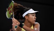 Japan's Naomi Osaka hits a return against Germany's Tamara Korpatsch during their women's singles match at the Brisbane International tennis tournament in Brisbane on January 1, 2024. (Photo by William West / AFP) 