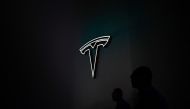 The Tesla logo is seen during the World Artificial Intelligence Conference (WAIC) in Shanghai on July 7, 2023. Photo by WANG Zhao / AFP

