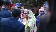 Bangladesh's Prime Minister Sheikh Hasina accepts the greetings from the assembled media and election observers while addressing a press conference, a day after she won the 12th parliamentary elections, in Dhaka on January 8, 2024. (Photo by INDRANIL MUKHERJEE / AFP)
