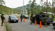 Soldiers check cars during a security operation on the alternative road to the Turi prison, in Cuenca, Ecuador, on January 9, 2024, a day after Ecuadorean President Daniel Noboa declared a state of emergency following the escape from prison of a dangerous narco boss. (Photo by Fernando Machado / AFP)
