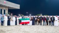 The team members of Bashir Al Bashir after the horse won gold in the Senior Stallions Championship at the 3rd Doha International Arabian Horse Show at Qatar Equestrian Federation’s outdoor arena. 