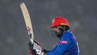 Afghanistan's Mohammad Nabi watches the ball after playing a shot during the first Twenty20 international cricket match between India and Afghanistan at the Punjab Cricket Association Stadium in Mohali on January 11, 2024. (Photo by Arun SANKAR / AFP)