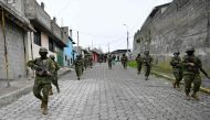 Army members patrol at the Lucha de los Pobres neighbourhood in southern Quito, on January 12, 2024. (Photo by Stringer / AFP)