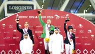 President of the Qatar Equestrian Federation (QEF) Bader Al Darwish, and Chairman of Doha Tour’s Supreme Organising Committee and QEF Secretary General Sheikh Ahmad bin Nooh Al Thani with podium winners of 1.55m CSI4*event.   