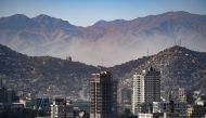 general view shows residential buildings against the backdrop of mountains in Kabul on January 16, 2024. (Photo by Omer ABRAR / AFP)