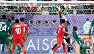 Saudi Arabia’s Ali Al Bulayhi (right) scores the winning goal. AFP
