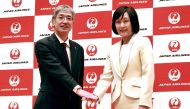 Japan Airlines' Senior Managing Executive Officer Mitsuko Tottori (R) and current president Yuji Akasaka pose for the media on January 17, 2024. (Photo by JIJI Press / AFP) 