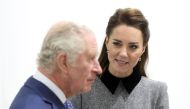 (FILES) Britain's Prince Charles, Prince of Wales (L) talks with Britain's Catherine, Duchess of Cambridge, during their visit to The Prince's Foundation's 'Trinity Buoy Wharf' training site for arts and culture, in east London on February 3, 2022. (Photo by Chris Jackson / POOL / AFP)
