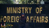 A Pakistani police officer stands guard outside Pakistan's Foreign Ministry building in Islamabad on January 18, 2024. (Photo by Aamir Qureshi / AFP)