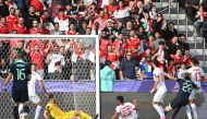 Australia’s Jackson Irvine (second right) scores a goal against Syria. AFP