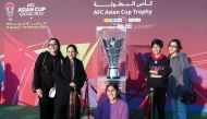 Visitors with the AFC Asian Cup trophy.