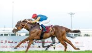 Simca Mille, with jockey Mickael Barzalona in the saddle, crosses the finish line to win the H E Sheikh Joaan Bin Hamad Al Thani Rifle, Thoroughbreds event.
