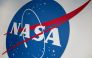 The NASA logo is displayed at the Earth Information Center exhibit, at NASA headquarters in Washington, DC, on June 21, 2023. Photo by Stefani REYNOLDS / AFP