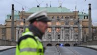 A police officer cordon off an area near the university in central Prague, on December 21, 2023. (Photo by Michal CIZEK / AFP)

