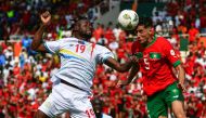 DR Congo's forward #19 Fiston Mayele (L) fights for the ball with morocco's defender #5 Nayef Aguerd during the Africa Cup of Nations (CAN) 2024 group F football match between morocco and DR Congo at Stade Laurent Pokou in San Pedro on January 21, 2024. (Photo by SIA KAMBOU / AFP)

