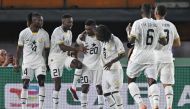 Ghana's midfielder #20 Mohamed Kudus celebrates with teammates after scoring his team's first goal during the Africa Cup of Nations (CAN) 2024 group B football match between Egypt and Ghana at the Felix Houphouet-Boigny Stadium in Abidjan on January 18, 2024. (Photo by Issouf SANOGO / AFP)
