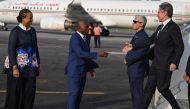 Ivory Coast's Minister of Foreign Affairs Kacou Houadja Leon Adom (2nd R) and US Ambassador to Ivory Coast Jessica Davis Ba (L) welcome US Secretary of State Antony Blinken (R) as he arrives at the Félix Houphouet-Boigny International Airport in Abidjan on January 22, 2024. (Photo by ANDREW CABALLERO-REYNOLDS / POOL / AFP)
