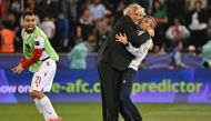 Tajikistan's Croatian coach Petar Segrt celebrates with his assistant after the Qatar 2023 AFC Asian Cup Group A football match between Tajikistan and Lebanon at the Jassim bin Hamad Stadium in Doha on January 22, 2024. (Photo by Hector Retamal / AFP)