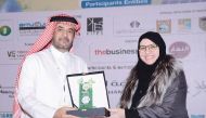 Assistant Director of Waste Recycling and Treatment Department Hassan Nasr Al Nasr (left) receiving the award.