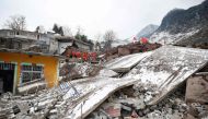 Rescue personnel search for missing victims following a landslide in Liangshui village at Zhaotong, in southwestern China's Yunnan province on January 22, 2024. Photo by AFP