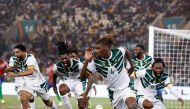 Cameroon's defender #4 Christopher Wooh celebrates scoring his team's third goal during the Africa Cup of Nations (CAN) 2024 group C football match between Gambia and Cameroon at Stade de la Paix in Bouake on January 23, 2024. (Photo by KENZO TRIBOUILLARD / AFP)
