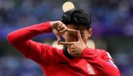 South Korea's midfielder #07 Son Heung-min celebrates after scoring his team's third goal from the penalty spot during the Qatar 2023 AFC Asian Cup Group E football match between South Korea and Malaysia at Al-Janoub Stadium in al-Wakrah, south of Doha, on January 25, 2024. (Photo by Giuseppe CACACE / AFP)
