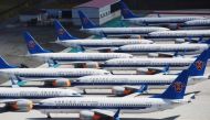 This photo taken on June 5, 2019 shows grounded China Southern Airlines Boeing 737 MAX aircraft parked in a line at Urumqi airport, in China's western Xinjiiang region. Photo by GREG BAKER / AFP