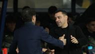 Barcelona's Spanish coach Xavi greets Villarreal's Spanish coach Marcelino Garcia Toral before the start of the Spanish league football match on January 27, 2024. (Photo by Lluis Gene / AFP)