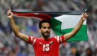 Jordan's players celebrate their team's historic win at the Khalifa International Stadium, yesterday. AFP