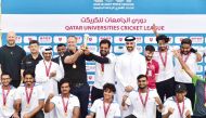 QU Cricket team with the trophy at the end of the final match of the Universities Cricket League.