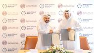 Media City Qatar Chairman H E Sheikh Dr. Abdulla bin Ali Al Thani and Chief Executive Officer of QFC Yousuf Mohamed Al Jaida (left) at the MoU signing.