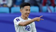 Uzbekistan’s midfielder Abbosbek Fayzullaev celebrates after scoring his team’s second goal. AFP