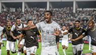 South Africa's midfielder #4 Teboho Mokoena (C) celebrates with teammates after scoring a goal during the Africa Cup of Nations (CAN) 2024 round of 16 football match between Morocco and South Africa at the Stade Laurent Pokou in San Pedro on January 30, 2024. (Photo by SIA KAMBOU / AFP)
