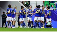 Japan players celebrate after Ayase Ueda (centre) scored their third goal against Bahrain. Pictures: Rajan Vadakkemuriyil/The Peninsula