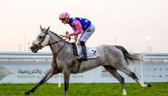 Jockey Lukas Delozier guides Talg’at Al Shahania to Al Jumail Cup victory at Al Uqda Racecourse, yesterday.