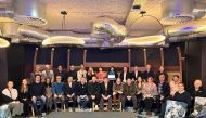 Officials pose for a photo during the European Multiclub Sport Association's General Assembly held in Brussels, Belgium.