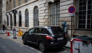 Cars are parked in Paris city center on February 2, 2024 as Paris' city hall is organizing a vote on February 4 on the creation of a special parking fee for heaviest and most polluting cars and SUVs. (Photo by Dimitar DILKOFF / AFP)