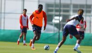 Al Duhail's Michael Olunga (second left) in action during a training session.