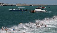 Swimmers compete in the final of the men’s 10km open water swimming event. AFP