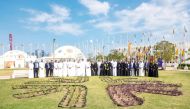 QNB officials taking part in the staff planting event at Expo Doha 2023.
