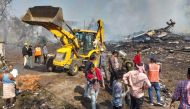 Rescue personnel and local residents gather near a firecracker plant following an explosion at Harda district in India's Madhya Pradesh state on February 6, 2024. (Photo by Uma Shankar Mishra / AFP)
