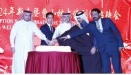 Director of Department of Protocol at the Ministry of Foreign Affairs H E Ambassador Ibrahim Fakhroo (left); Ambassador of China to Qatar H E Cao Xiaolin (second left) along with other officials during the cake-cutting ceremony.